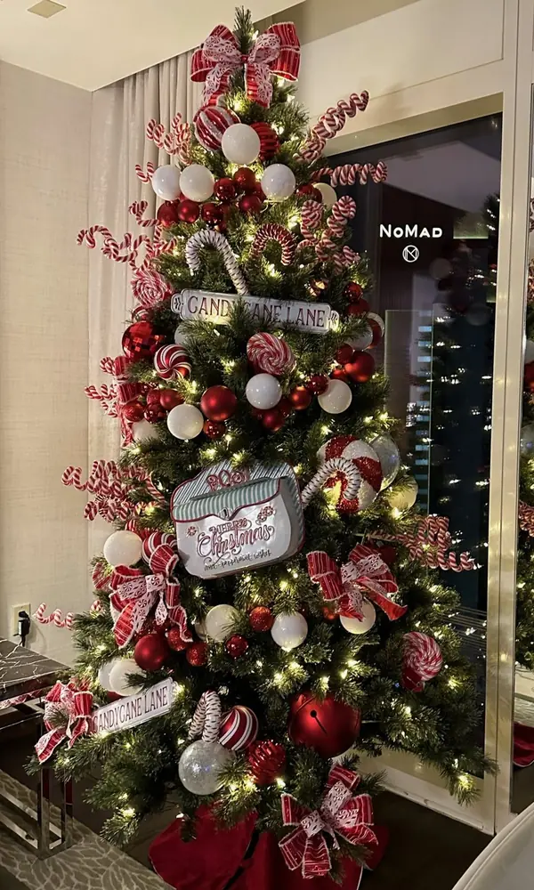 Red and white candy cane Christmas tree in a hotel suite