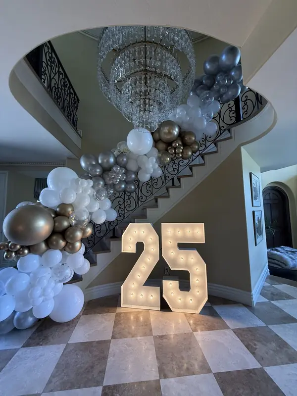 Balloon garland cascading down a grand staircase